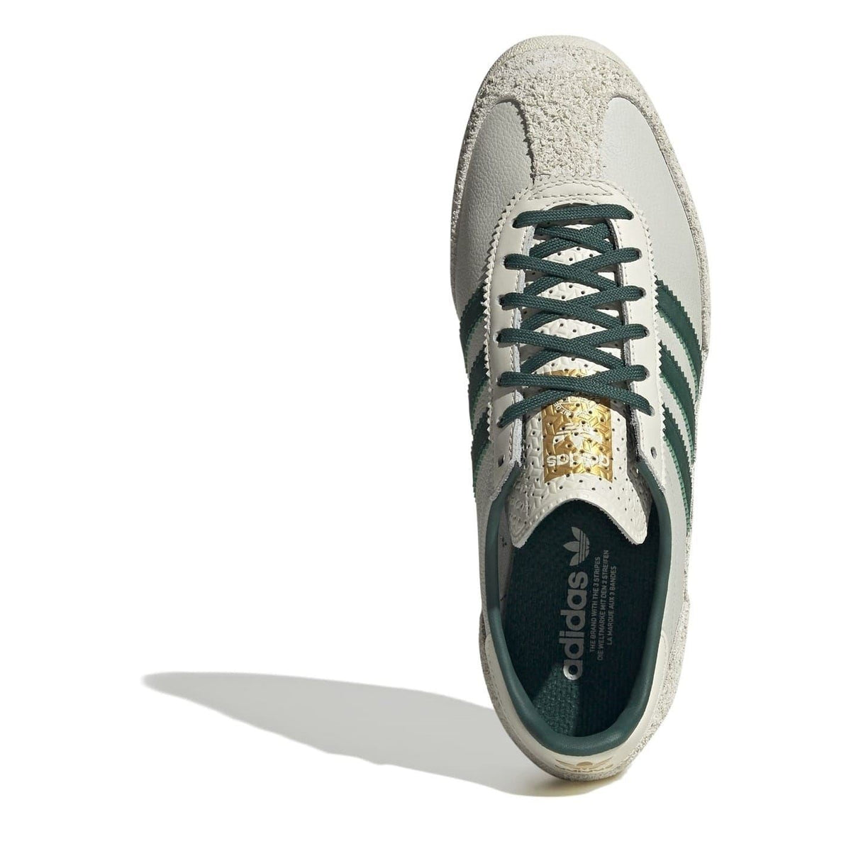 adidas Originals Sl72 sneakers, classic white footwear with black accents, showcasing the retro athletic shoe design.