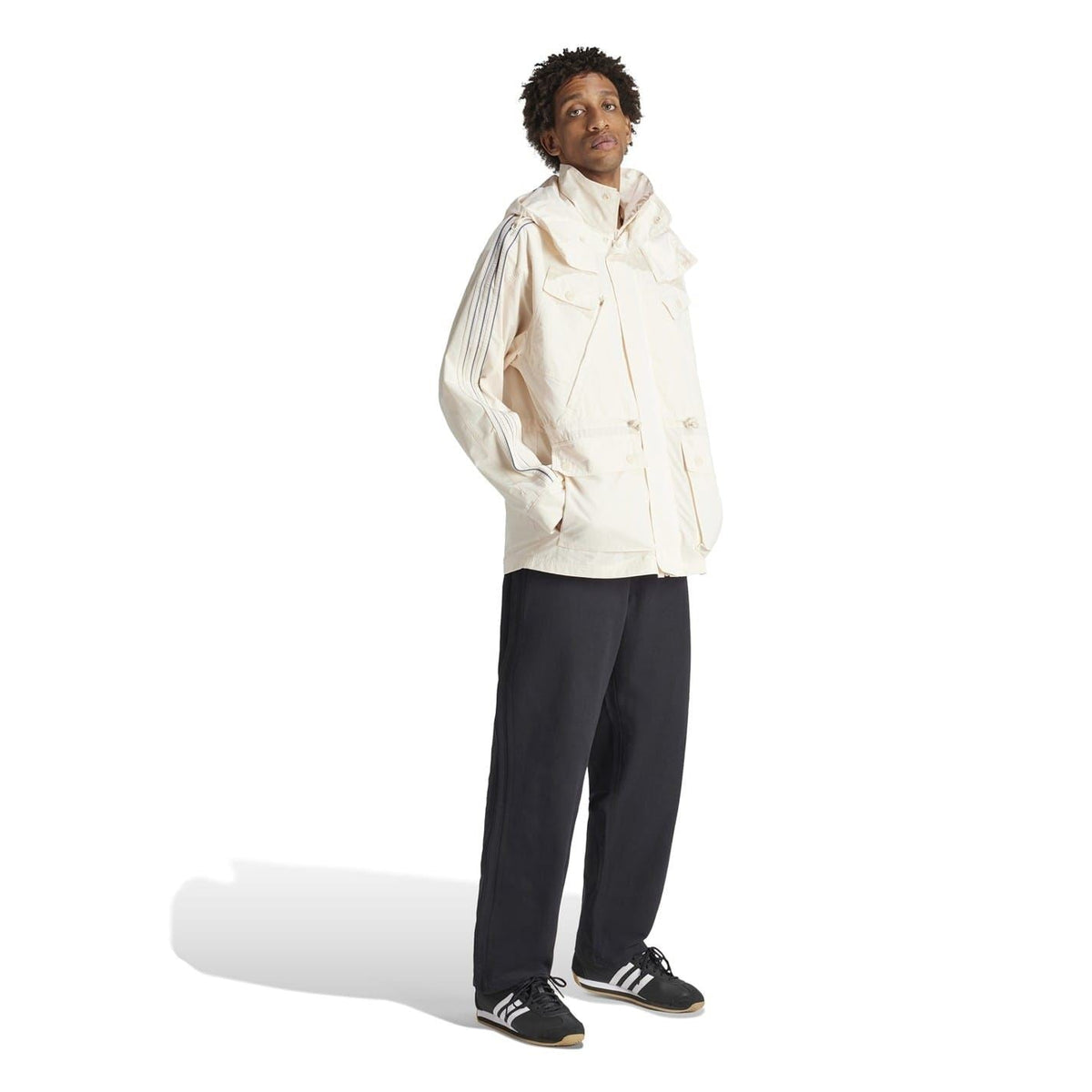 adidas Originals windbreaker jacket with external pocket, lightweight coat featuring a sporty design and adjustable hood