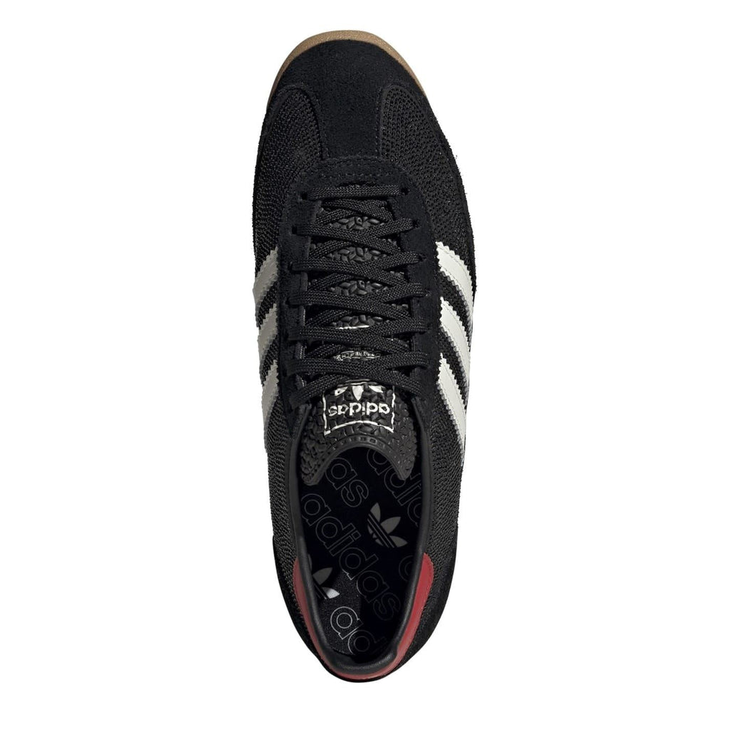 Adidas Originals Sl72 shoes in white and navy, showcasing classic sneaker design with suede and canvas materials.